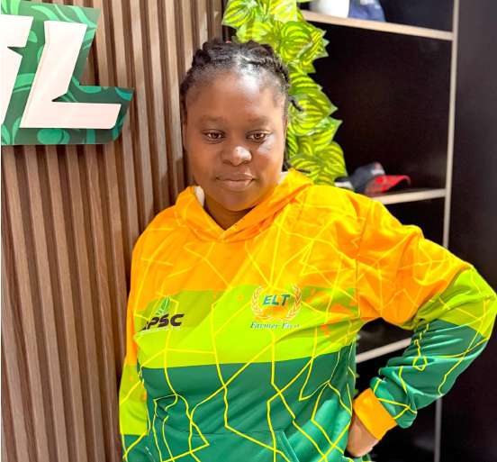 Woman in a green and yellow patterned hoodie