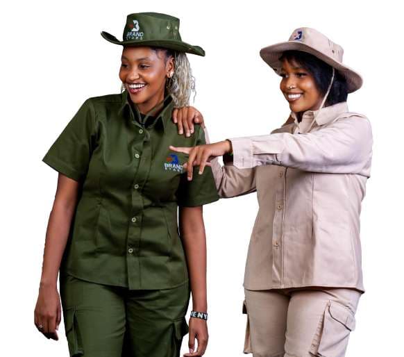 Two women in olive and khaki safari shirts with matching hats
